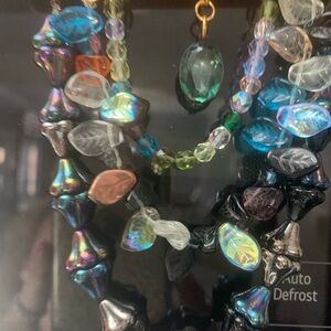 Iridescent Glass Beaded hanging ornament with multicolored Leaf Accents